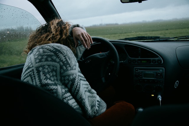 woman sleeping in car