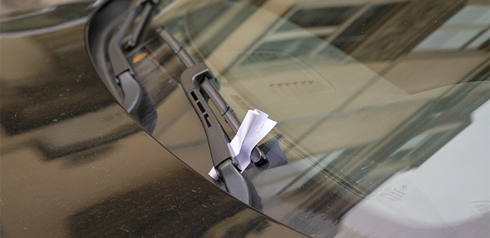 Parking ticket stuck on car windscreen for a penalty or fine