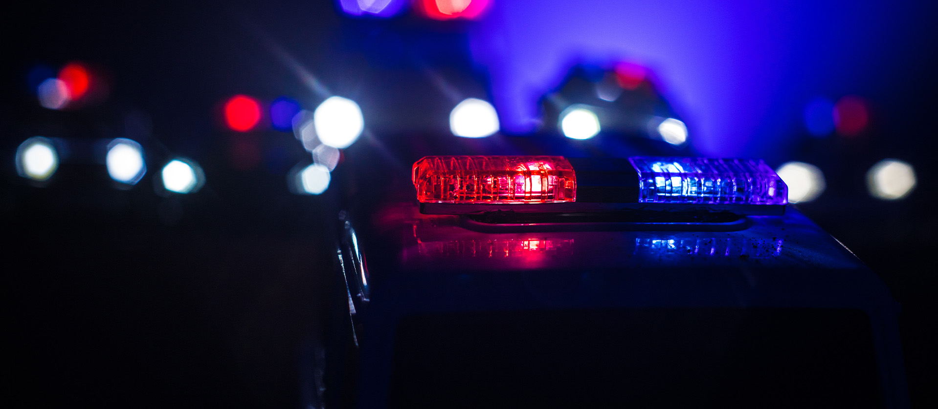 Police cars at night Police car chasing a car at night with fog background