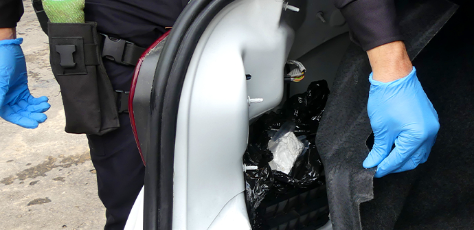 Police discover a small cache of cocaine hidden in a car