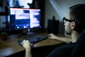 man looking at computer screen