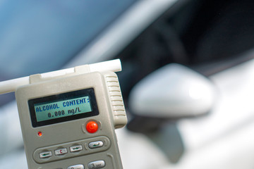 breathalyzer test in front of car