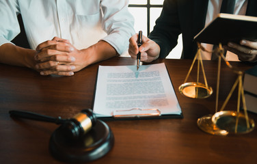 lawyer and client with gavel and papers