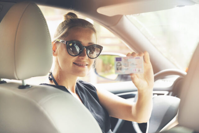 woman holding driver's license